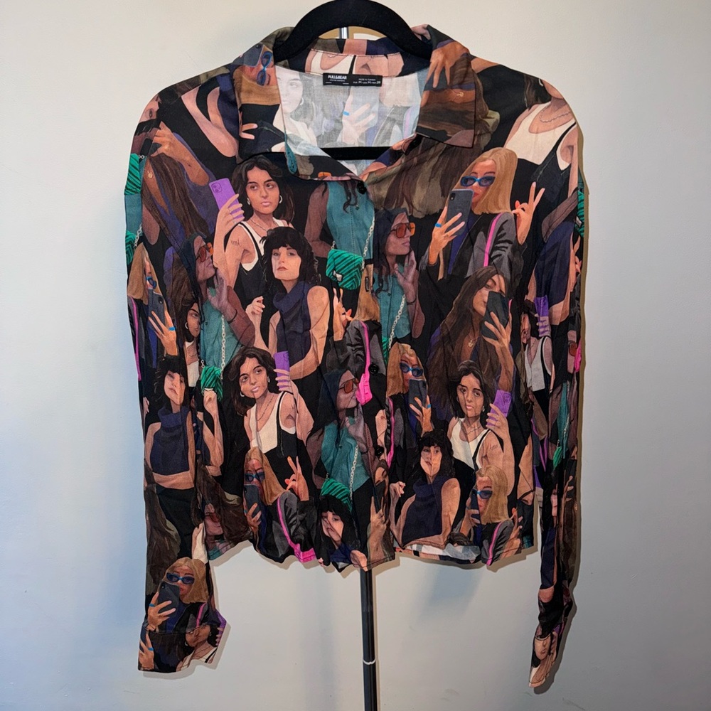 Long sleeve button blouse with girls print. Lightly baggy.